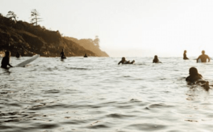 Sunset surfers Cox Bay